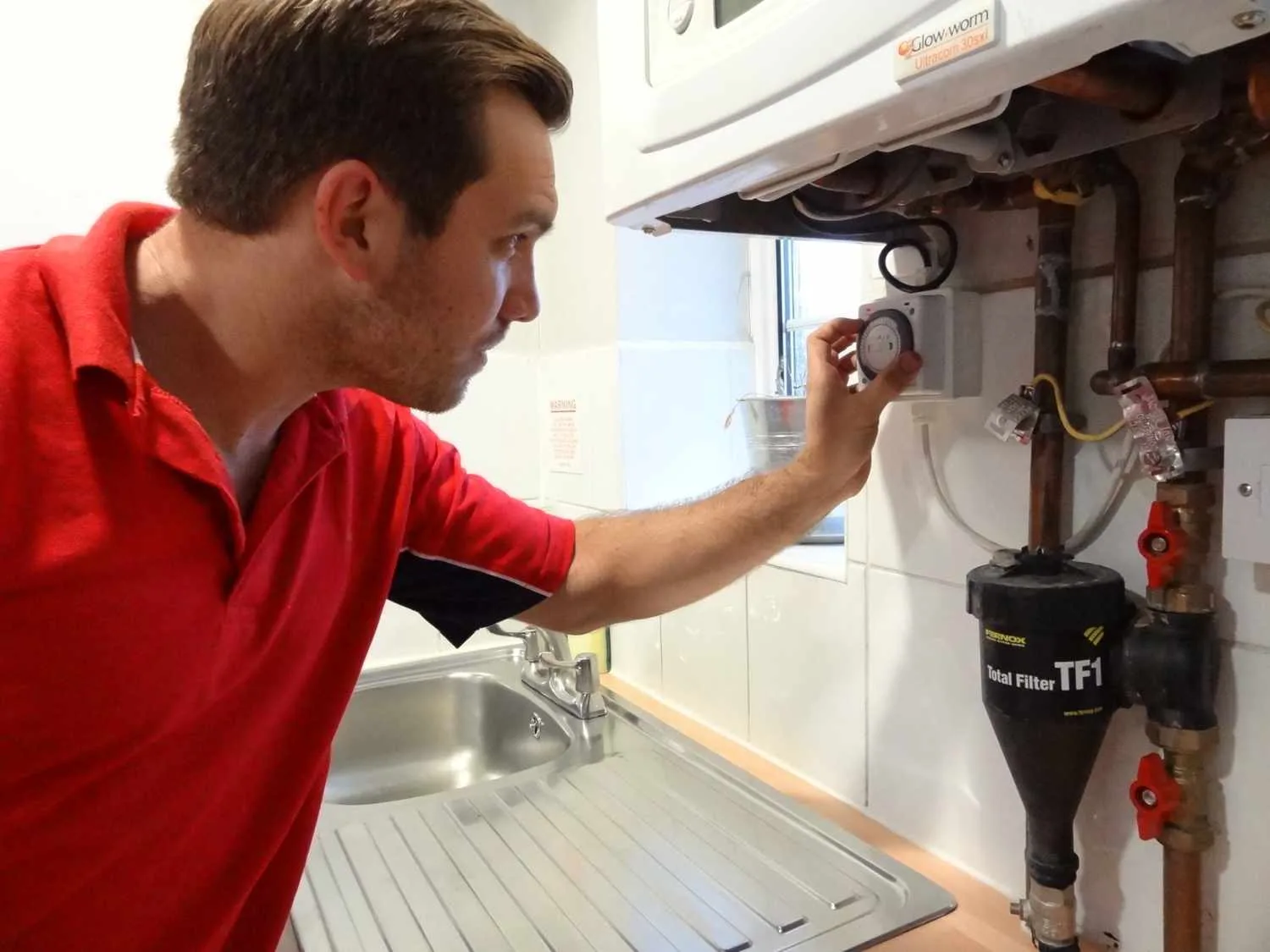 Finchley Plumbers 247 boiler repair engineer working on a boiler in Finchley